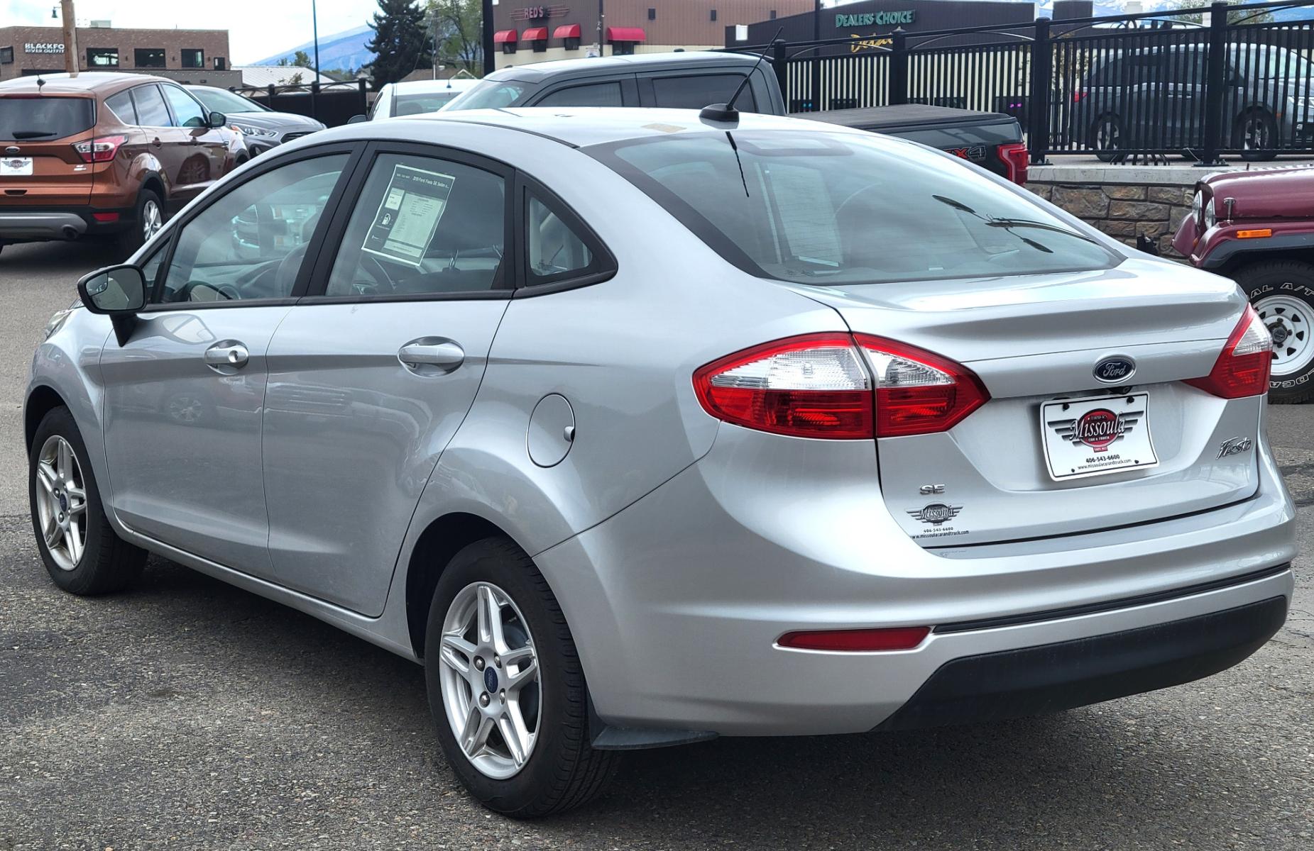 2019 Silver Ford Fiesta SE Sedan (3FADP4BJ2KM) with an 1.6L L4 DOHC 16V engine, Automatic transmission, located at 450 N Russell, Missoula, MT, 59801, (406) 543-6600, 46.874496, -114.017433 - Great little Economy Car in Very Good Condition. Low Miles. Automatic Transmission. Air Conditioning. Heated Seats. Power Windows. Cruise. Tilt. Backup Camera. - Photo #3
